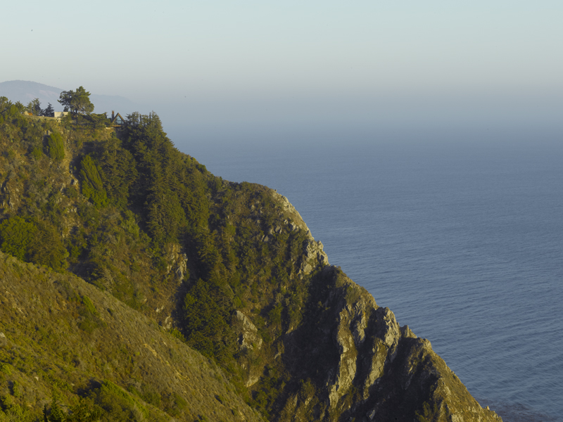 mountainside over ocean