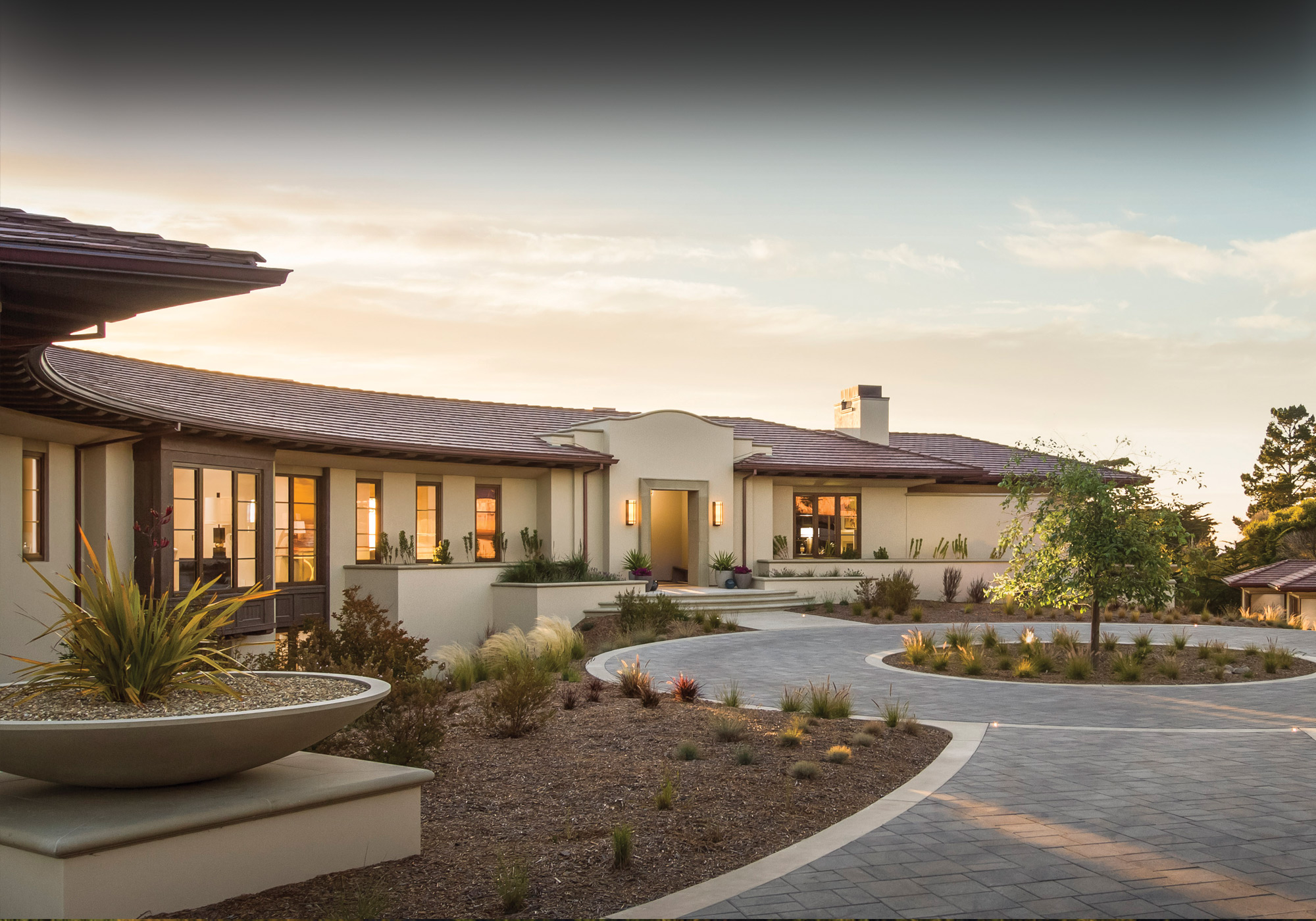 beautiful Pebble Beach home exterior in the evening